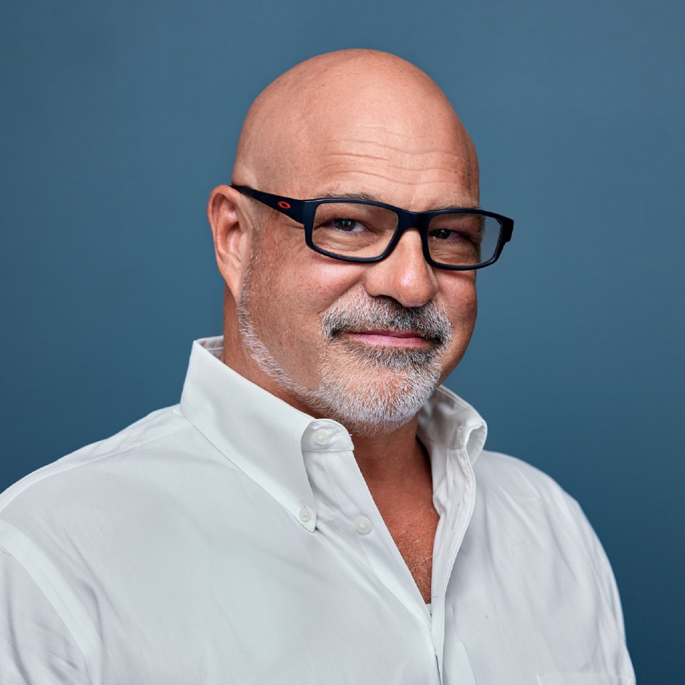 Man with glasses and white shirt representing recovery support services.